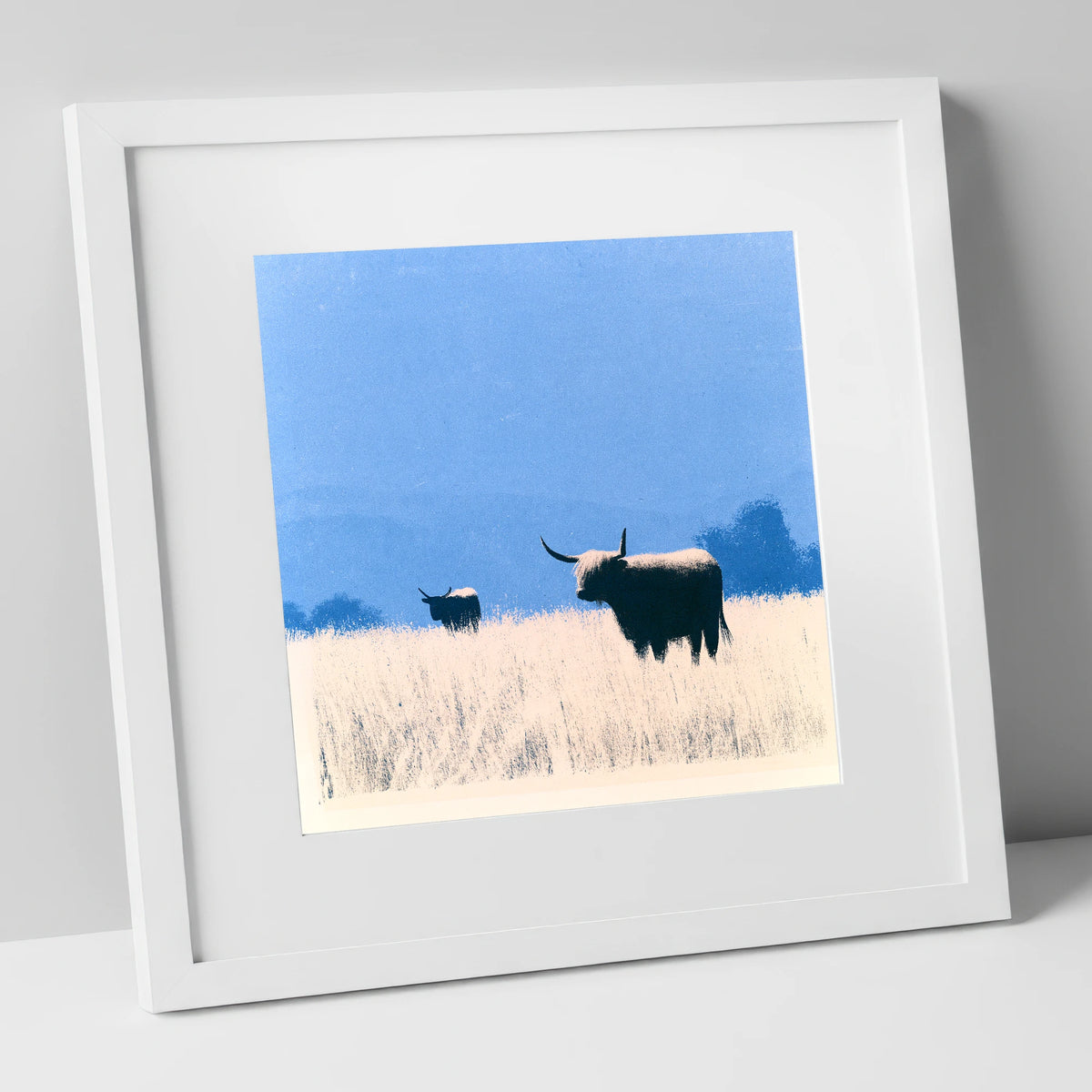 Highland Cattle Beneath Blue Skies lake district wildlife art print in white frame