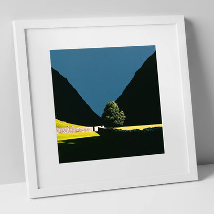 Sunlit Tree Between Silhouetted Fells lake district valley art print in white frame