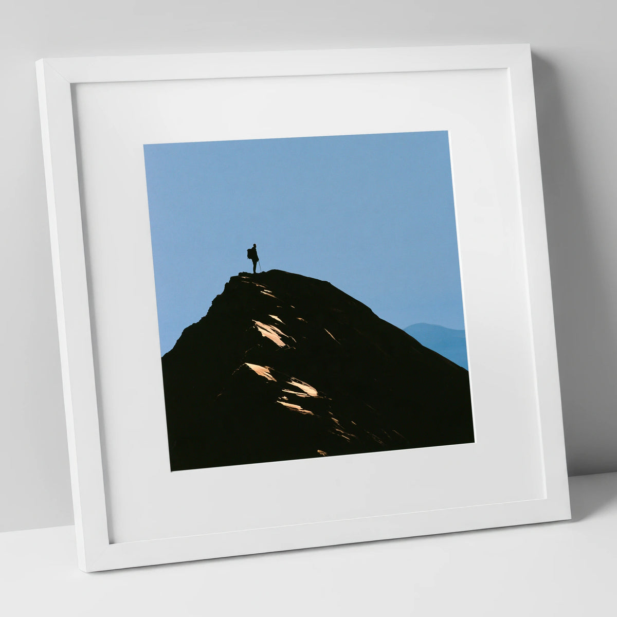 Walker Silhouette on Striding Edge lake district walking art print in white frame