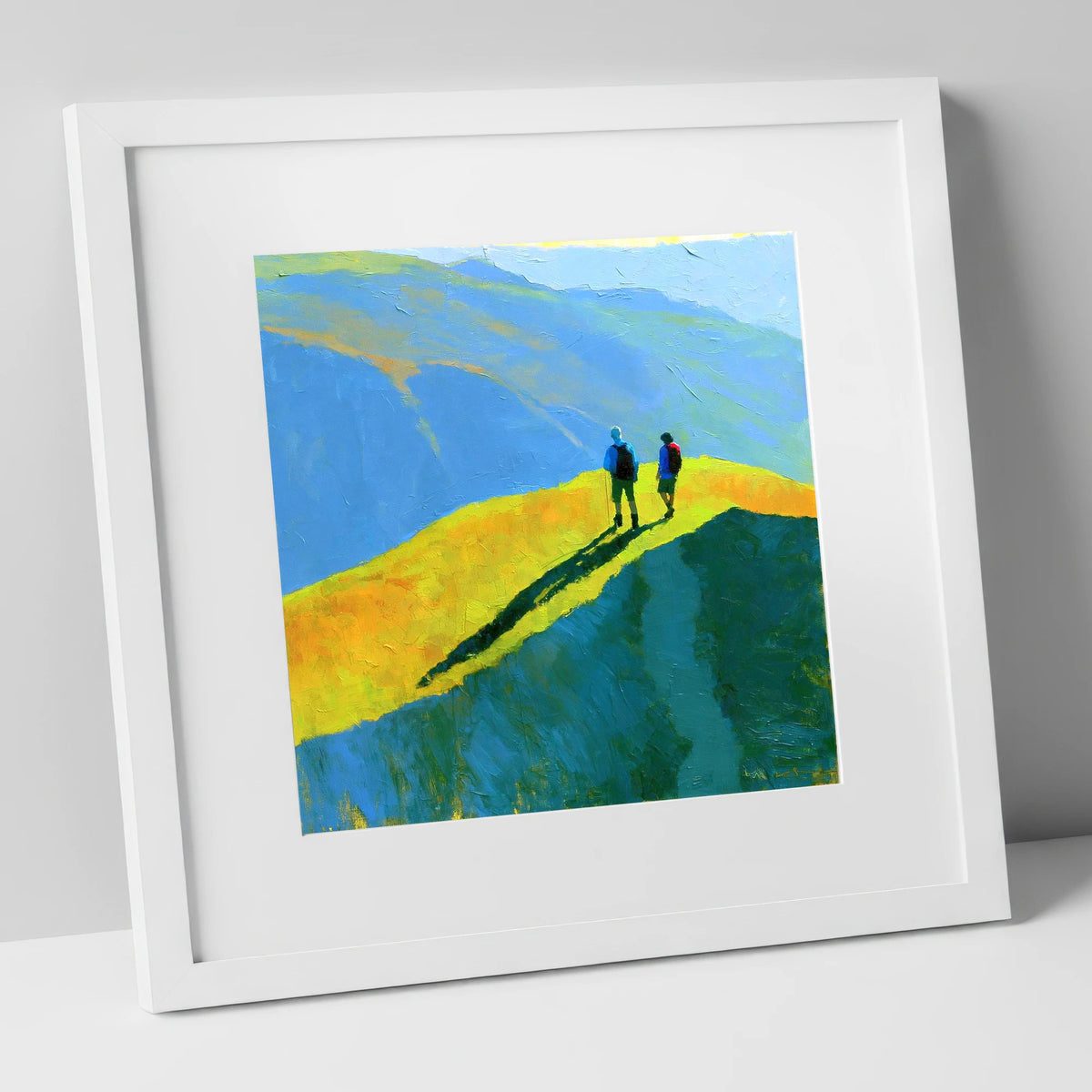Fell Walkers on a Vibrant Sunlit Ridge lake district fell art print in white frame