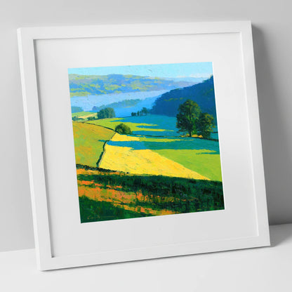 Sunlight and Shadow over Valley Fields lake district sky art print in white frame