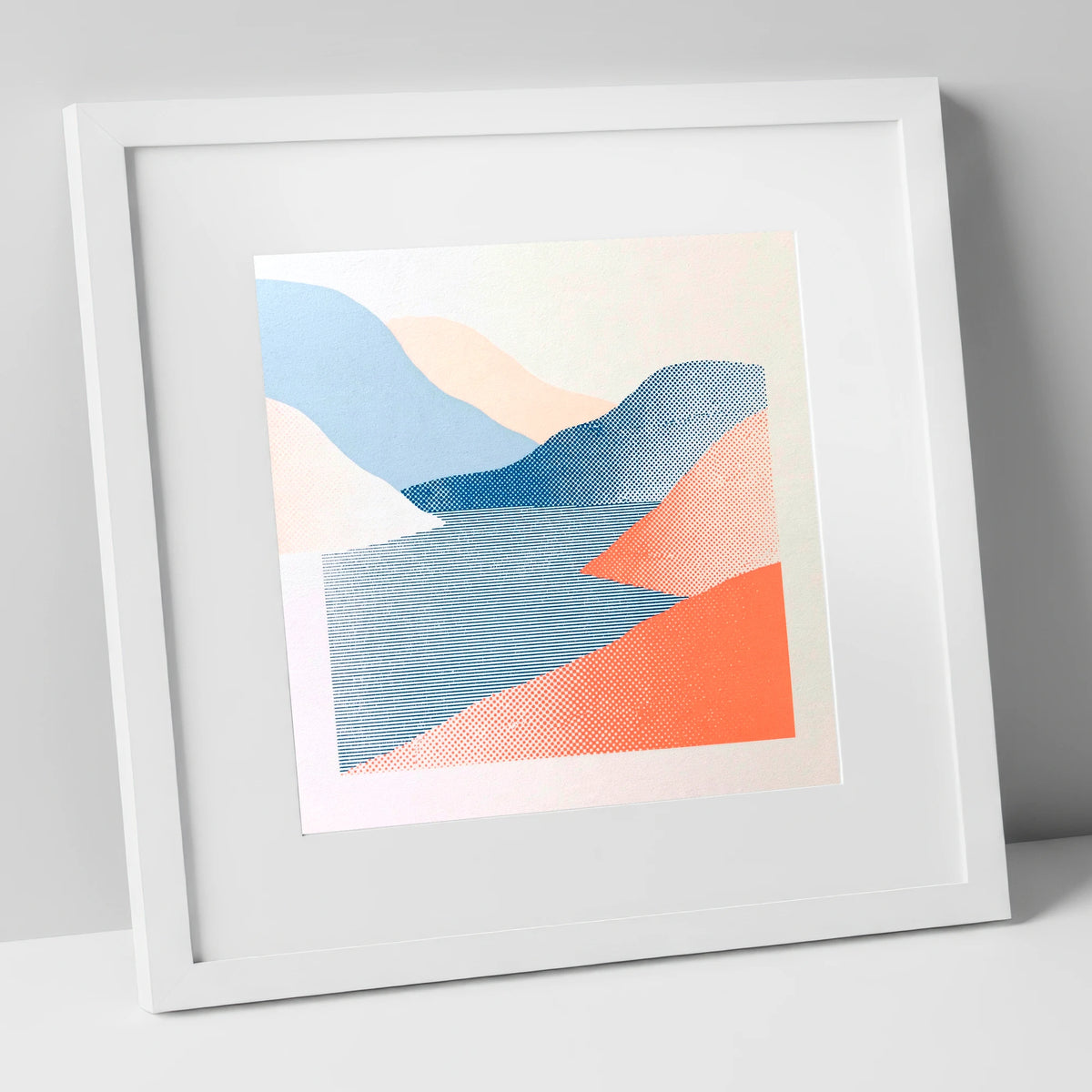 Graphic Coral and Blue Fells lake district lake art print in white frame