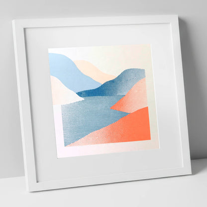 Graphic Coral and Blue Fells lake district lake art print in white frame