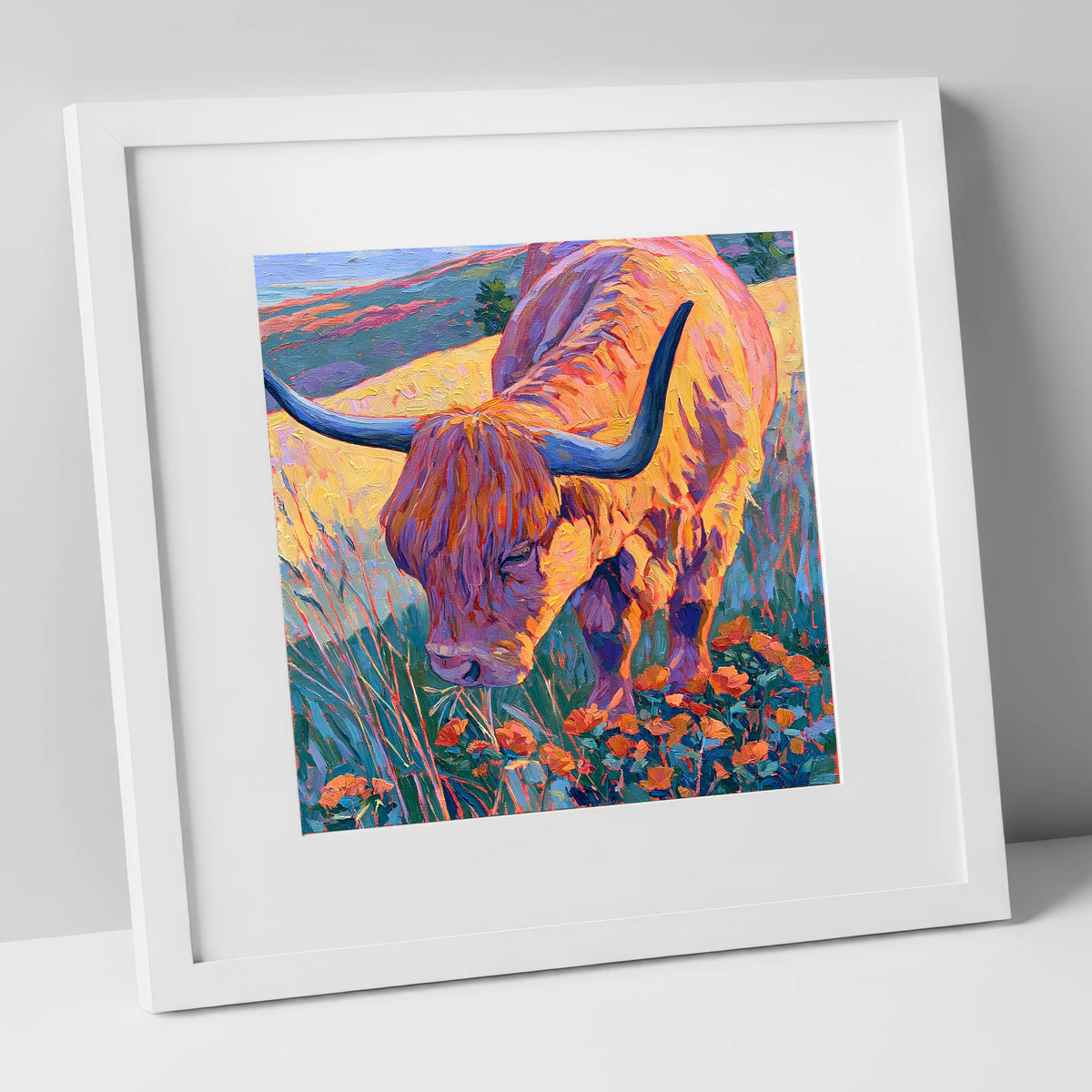 Vibrant Highland Cow Grazing the Fells lake district wildlife art print in white frame