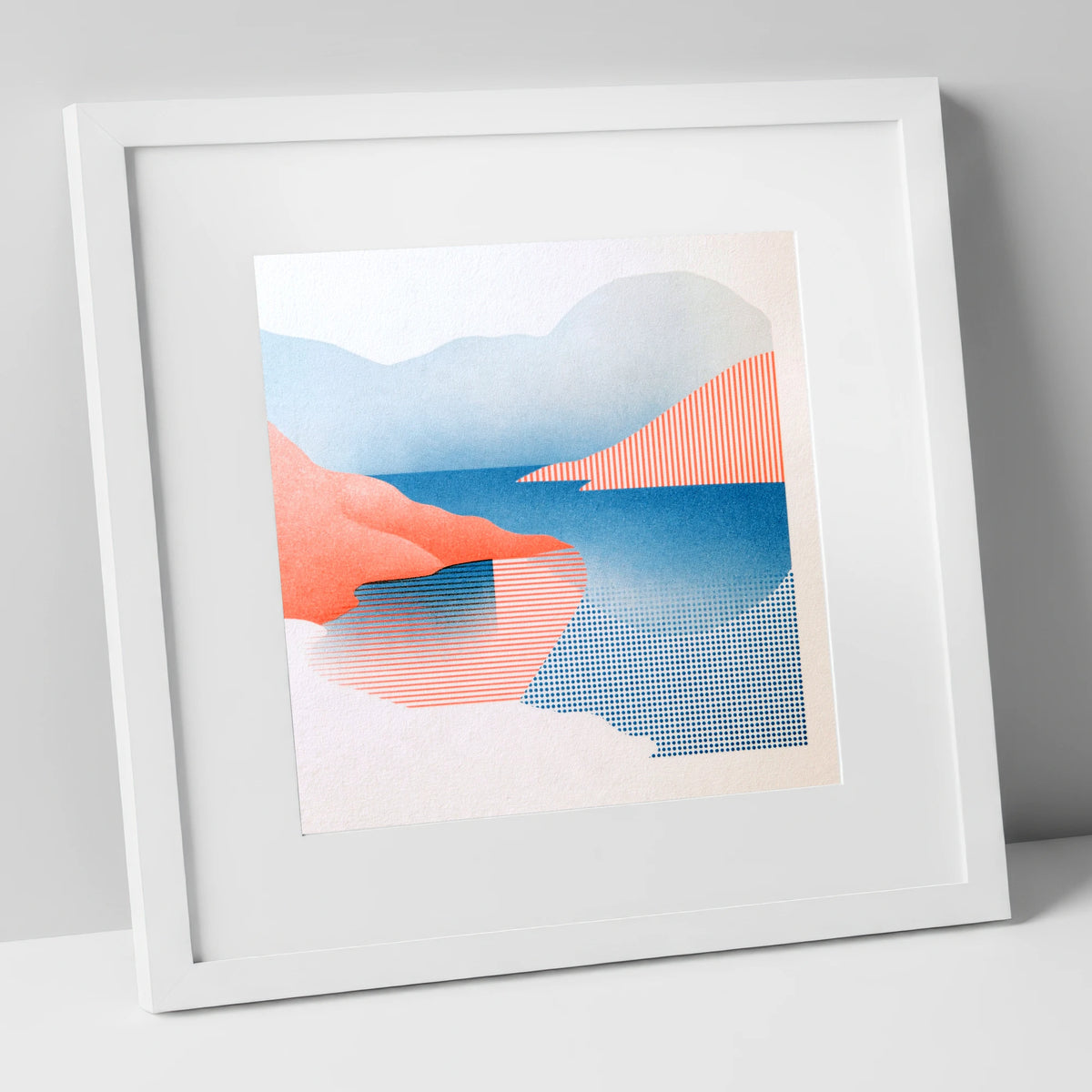 Buttermere Fells in Coral and Blue lake district lake art print in white frame