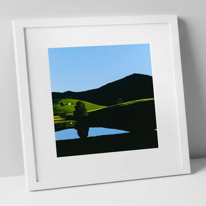 Sunlit Fells and Shadowed Peak lake district sky art print in white frame