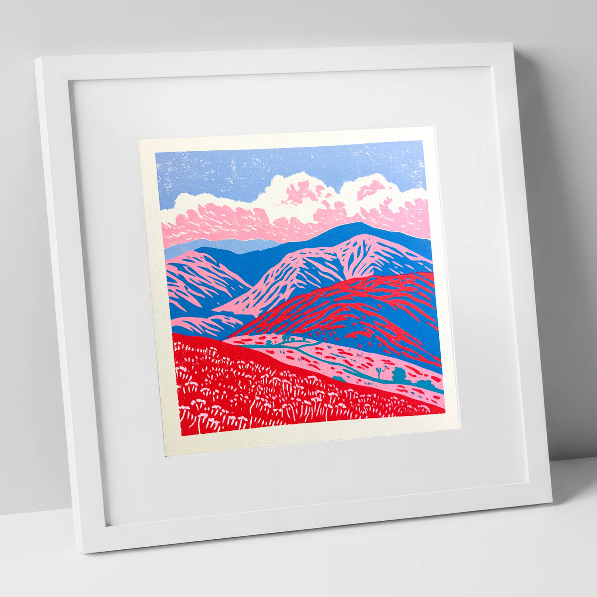 Red and Blue Rolling Fells lake district fell art print in white frame