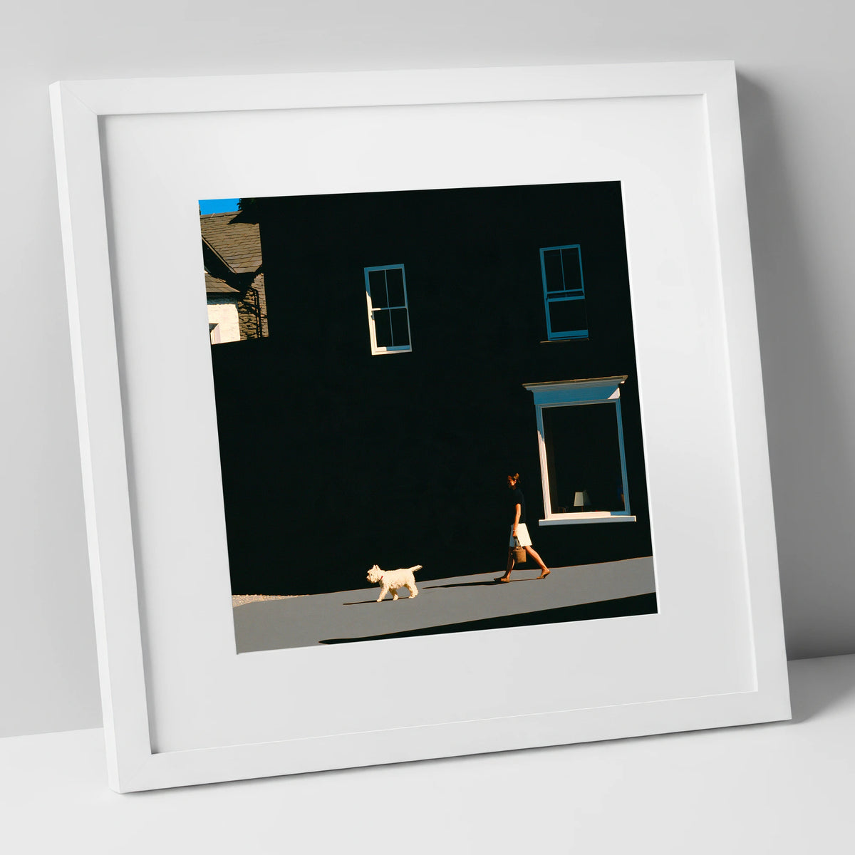 Sunlit Dog Walker in Ambleside gifts for dog walkers art print in white frame