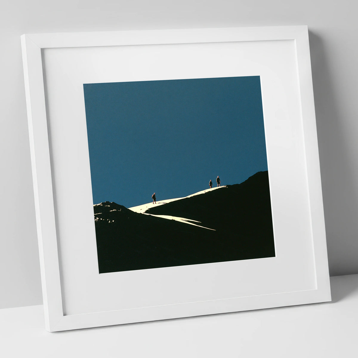 Hikers on a Sunlit Ridge lake district fell art print in white frame