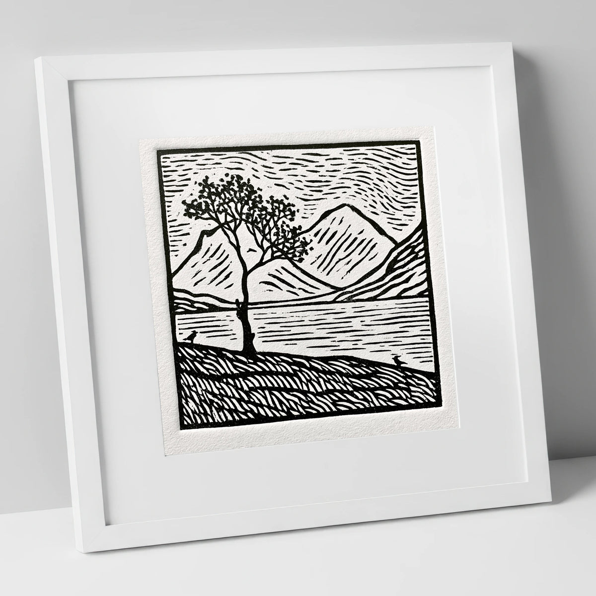 Monochrome Buttermere and Lone Tree lake district lake art print in white frame