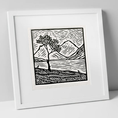 Monochrome Buttermere and Lone Tree lake district lake art print in white frame