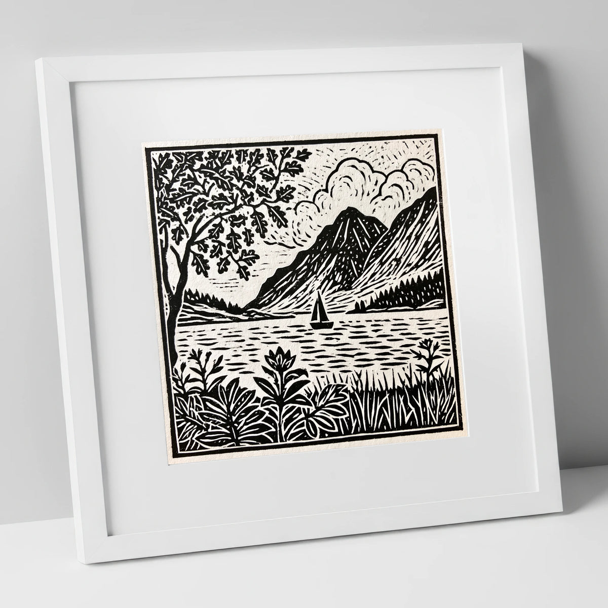 Monochrome Ennerdale Fells and Sailboat lake district valley art print in white frame