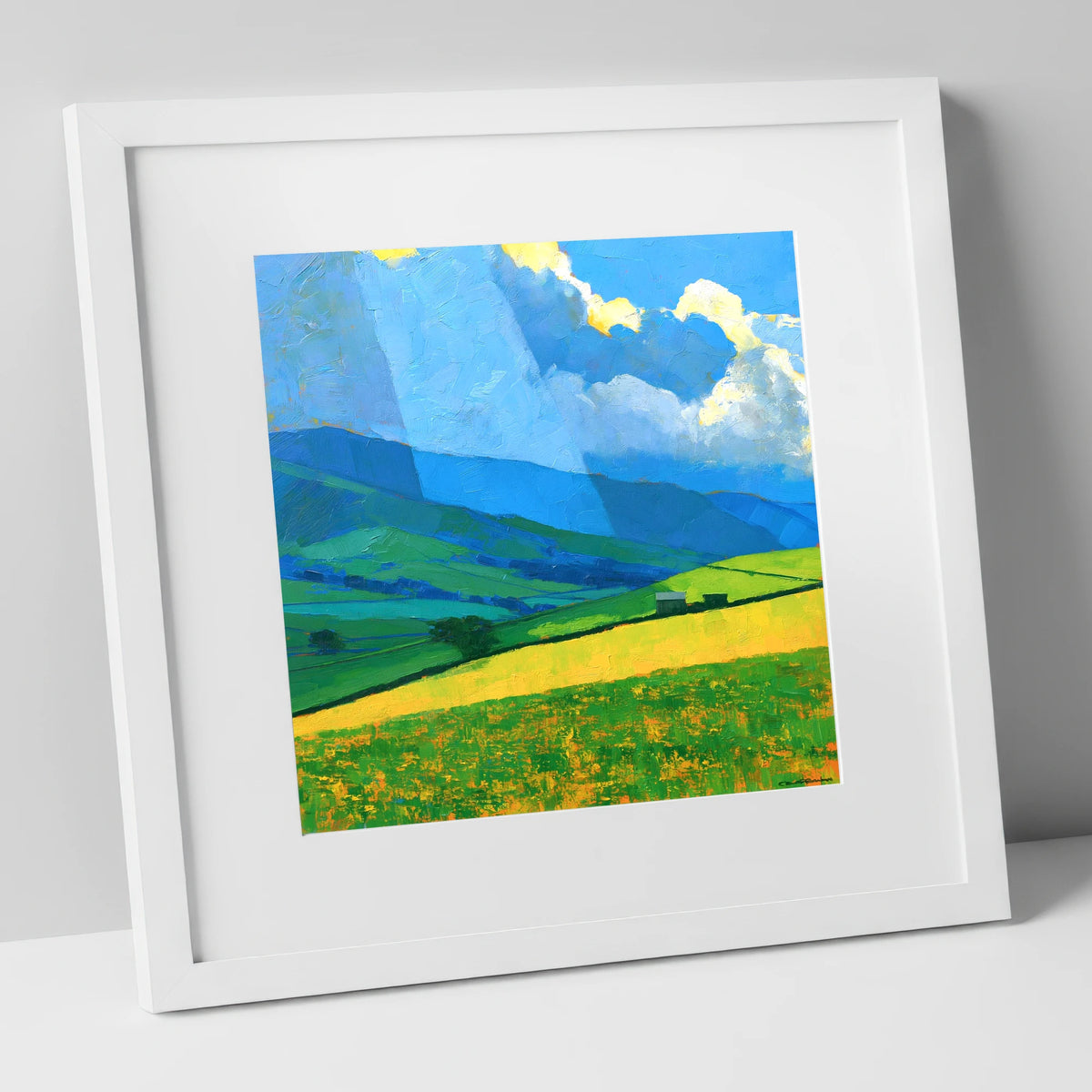 Sunlit Yellow Fields and Stormy Fells lake district sky art print in white frame