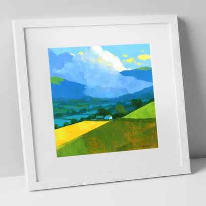 Vibrant Valley Fields and Towering Clouds lake district sky art print in white frame
