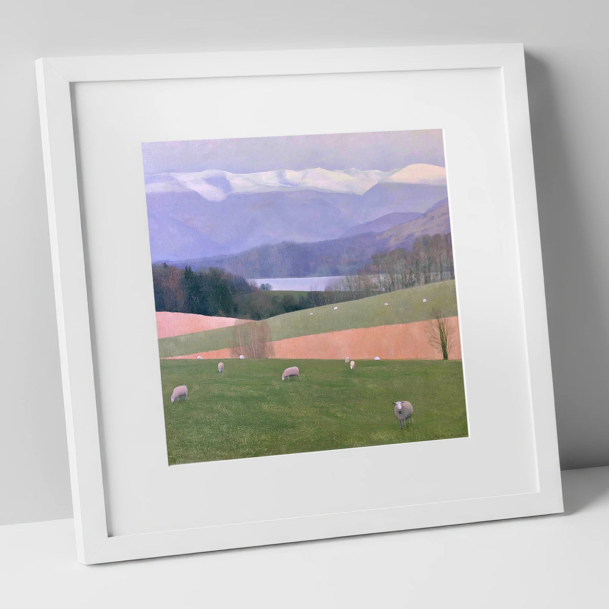 Hawkshead Pastures and Snowy Fells lake district village art print in white frame