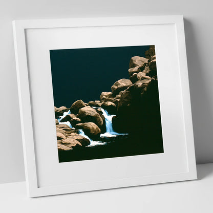 Tumbling Waterfall Among Sunlit Boulders lake district waterfall art print in white frame