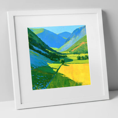 Vibrant Sunlit Valley with Blue Fellside Shadows lake district valley art print in white frame