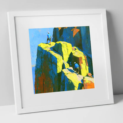 Mountaineers on a Sunlit Crag Pinnacle lake district walking art print in white frame