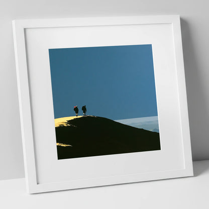 Silhouetted Hikers on a Fell Top lake district fell art print in white frame