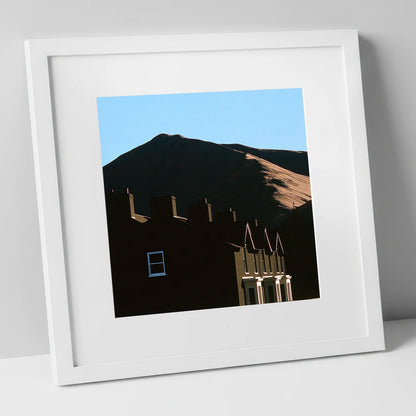 Silhouetted Keswick Terraces Beneath Skiddaw lake district village art print in white frame