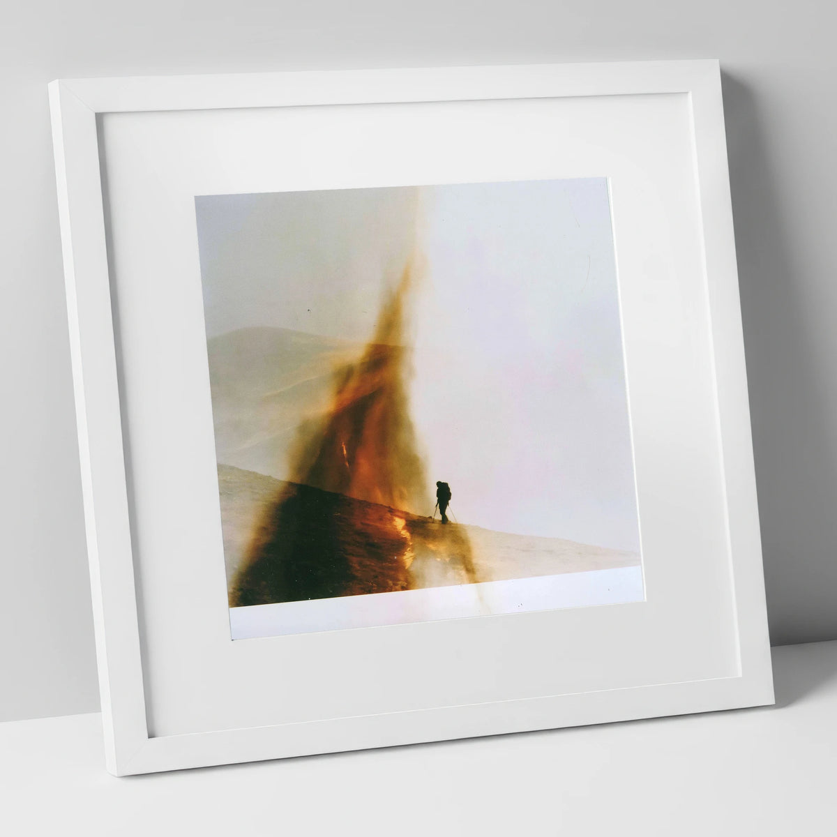 Fell-walker Silhouette in Amber Mist lake district walking art print in white frame