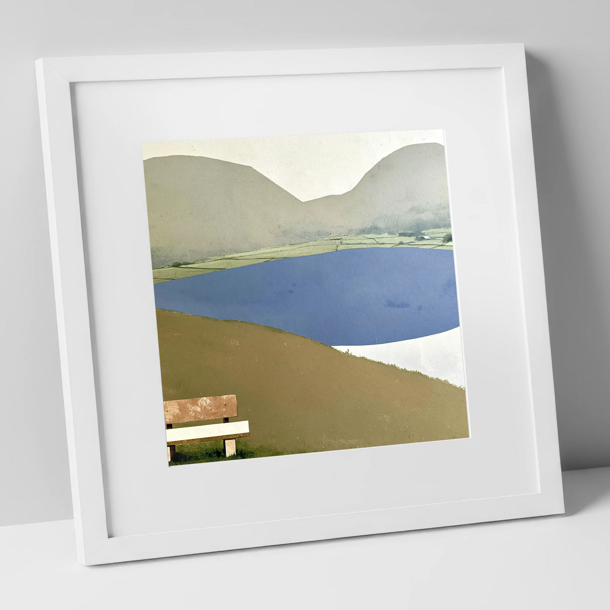 Bench Above Slate Blue Loweswater lake district lake art print in white frame