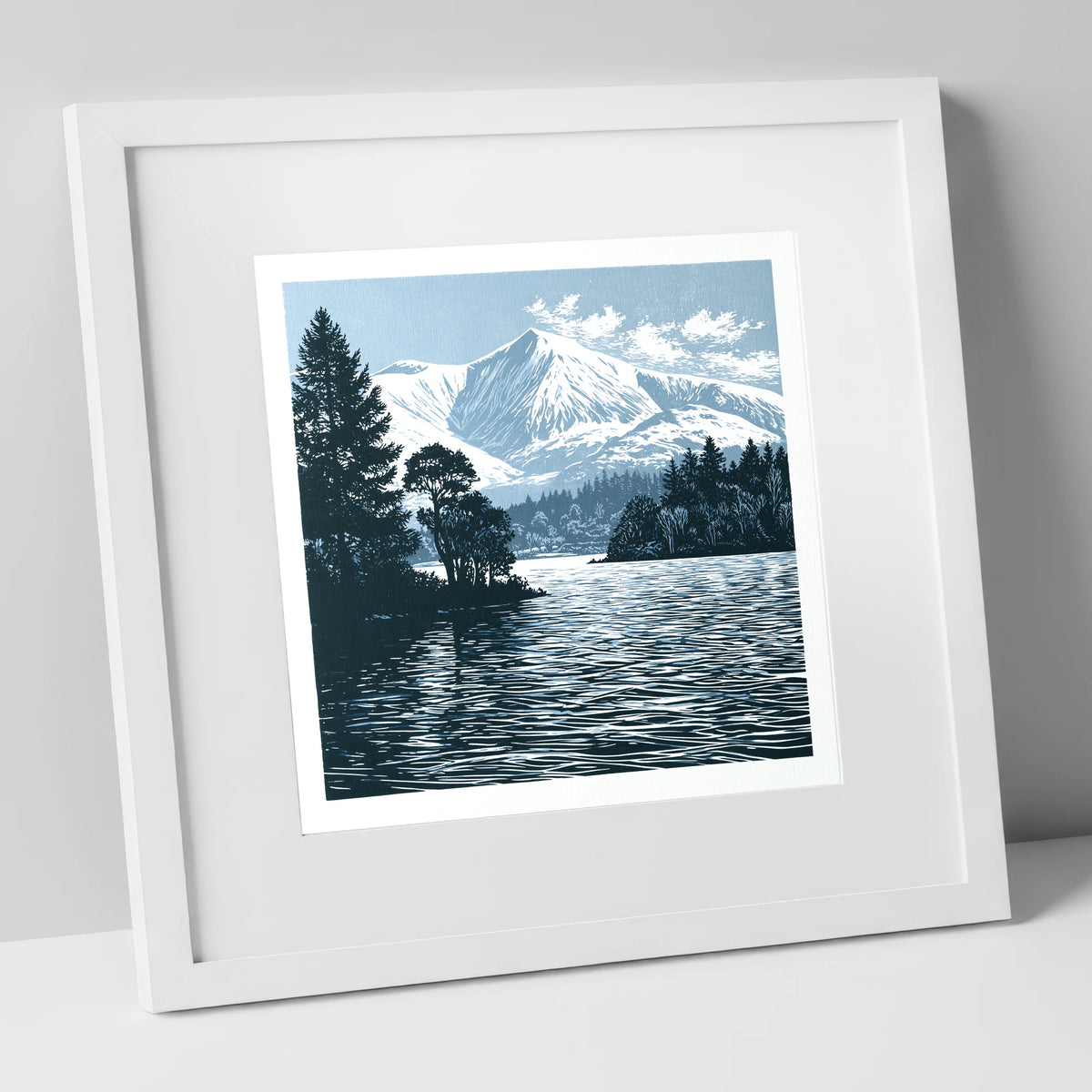 Winter Skiddaw in Deep Blue lake district fell art print in white frame