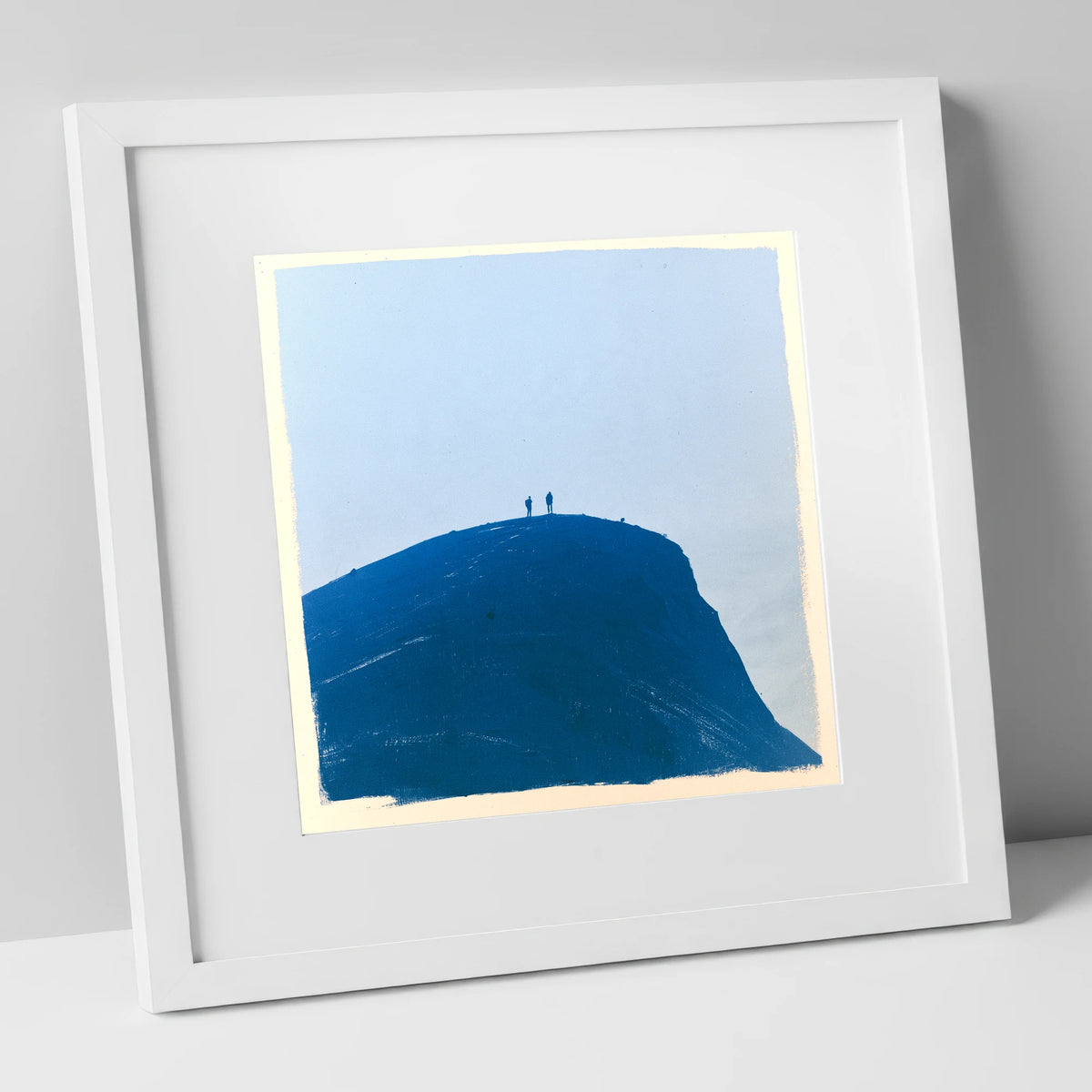 Hikers on a Blue Fell Top lake district fell art print in white frame