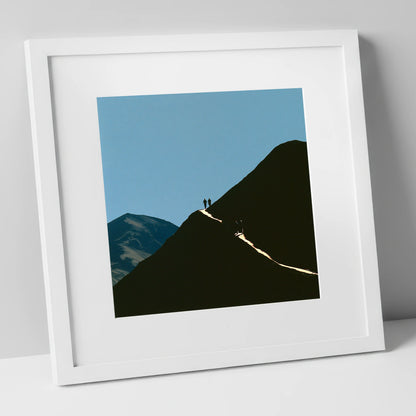 Walkers on a Sunlit Mountain Path lake district walking art print in white frame