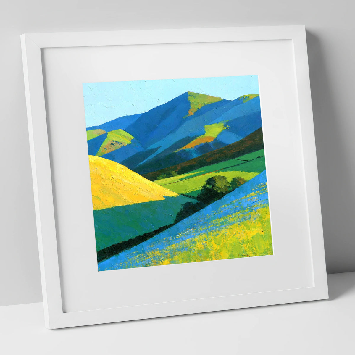 Vibrant Sunlight on Lakeland Fells lake district sky art print in white frame