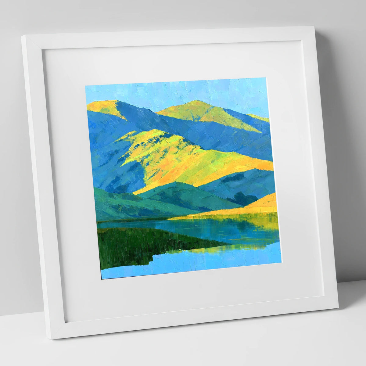 Sunlit Fells and Deep Blue Shadows lake district sky art print in white frame