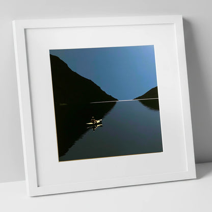 Illuminated Kayak on Dark Lake lake district walking art print in white frame