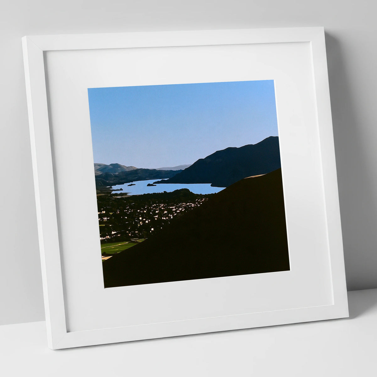 Keswick and Derwentwater in Silhouette lake district village art print in white frame