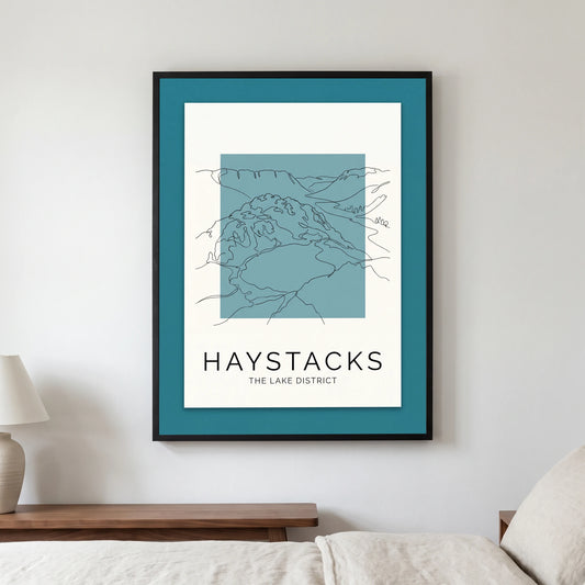 Haystacks travel poster in a black frame, hanging in a bedroom3