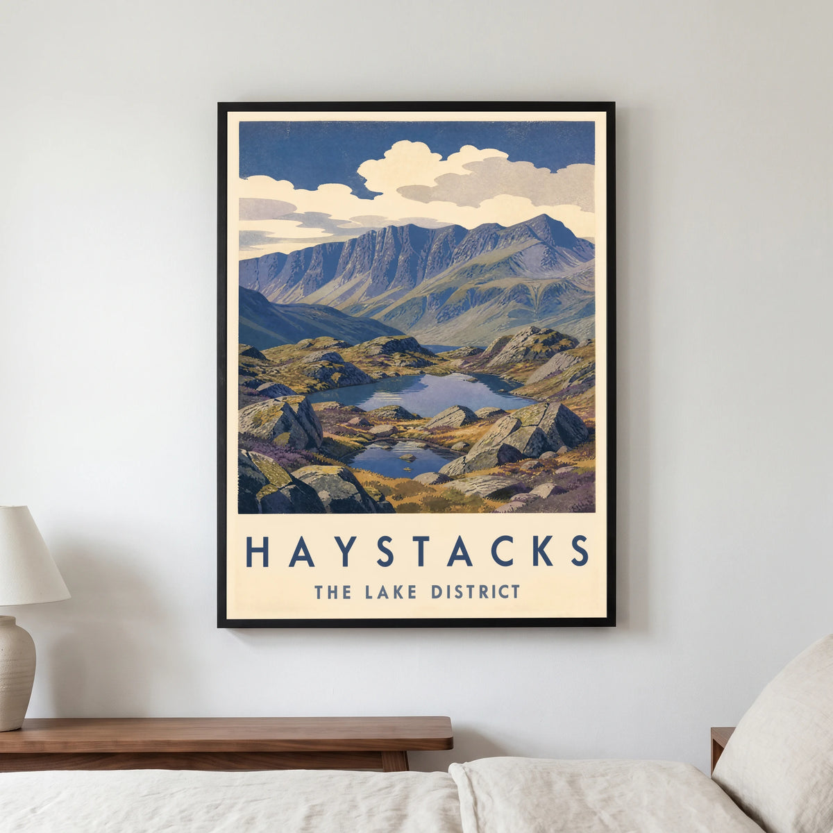 Haystacks travel poster in a black frame, hanging in a bedroom3