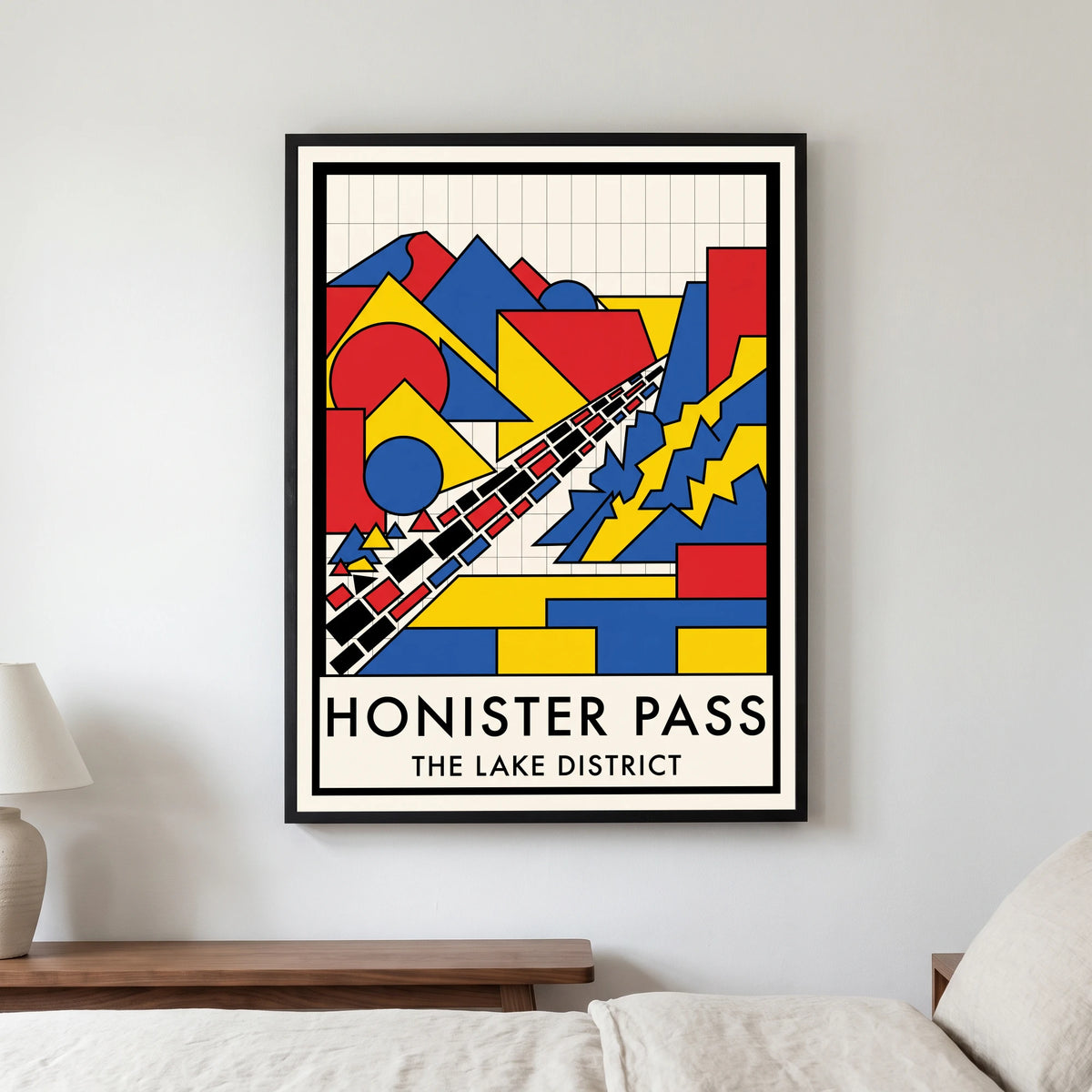 Honister Pass travel poster in a black frame, hanging in a bedroom3