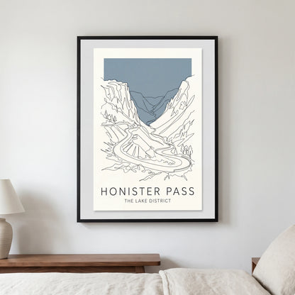 Honister Pass travel poster in a black frame, hanging in a bedroom3