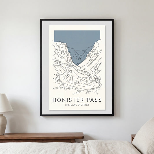 Honister Pass travel poster in a black frame, hanging in a bedroom3