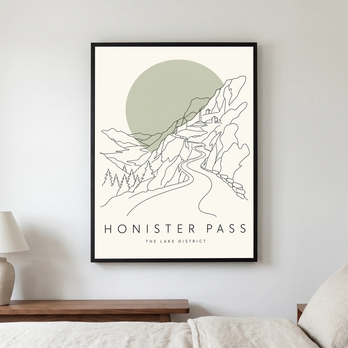 Honister Pass travel poster in a black frame, hanging in a bedroom3