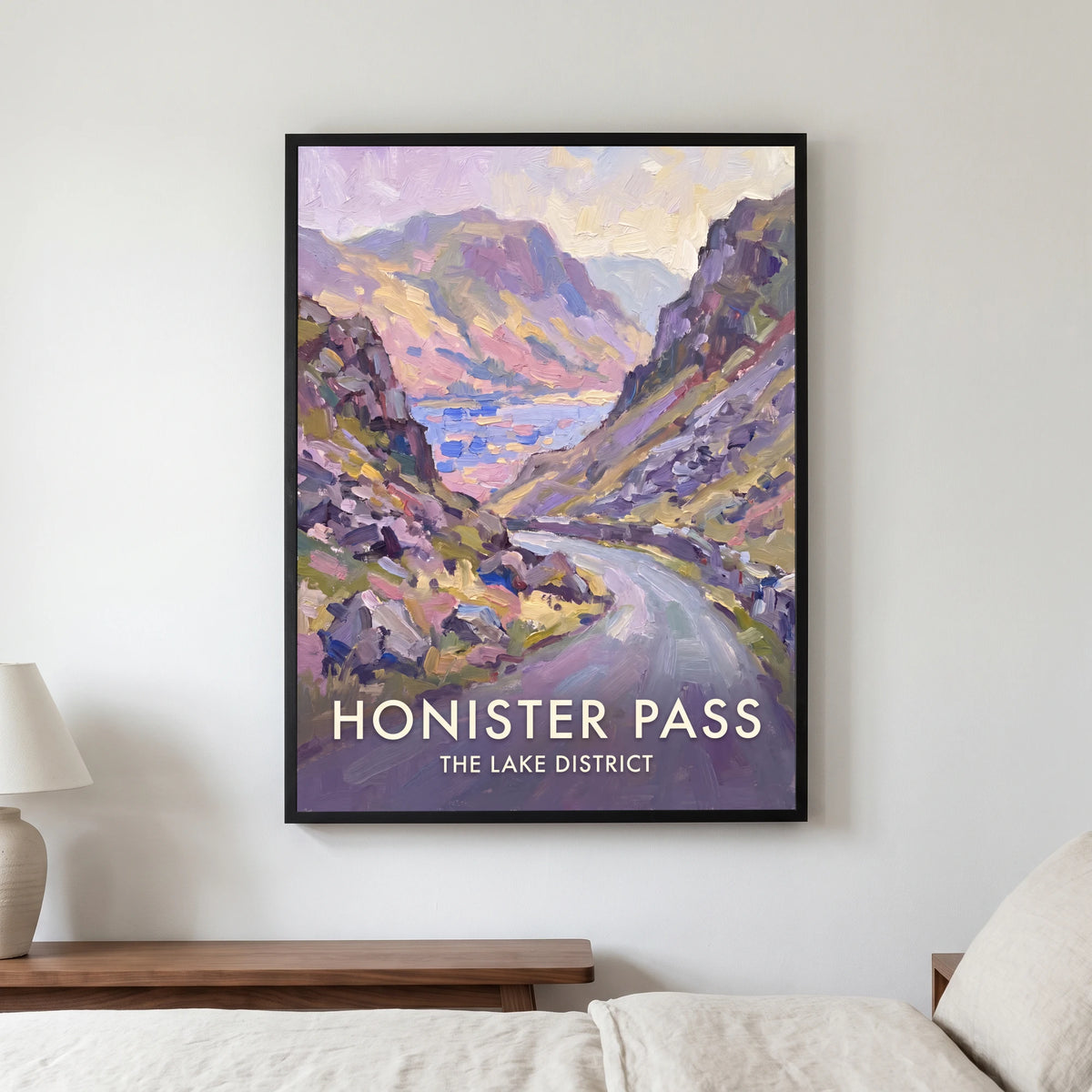 Honister Pass travel poster in a black frame, hanging in a bedroom3