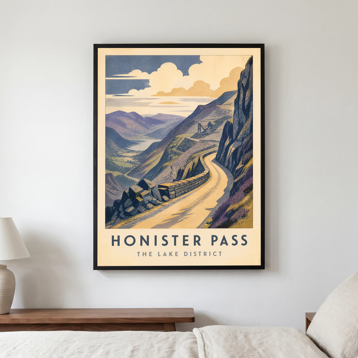 Honister Pass travel poster in a black frame, hanging in a bedroom3