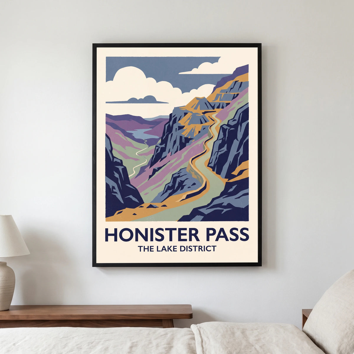 Honister Pass travel poster in a black frame, hanging in a bedroom3