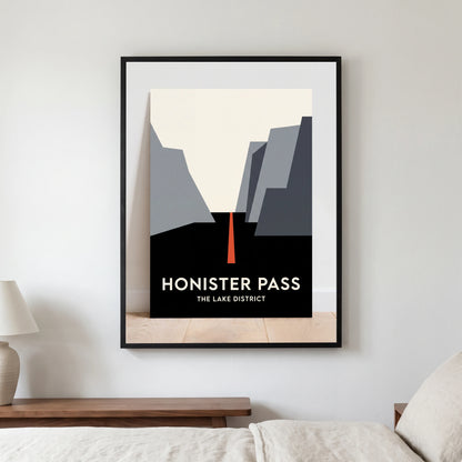 Honister Pass travel poster in a black frame, hanging in a bedroom3