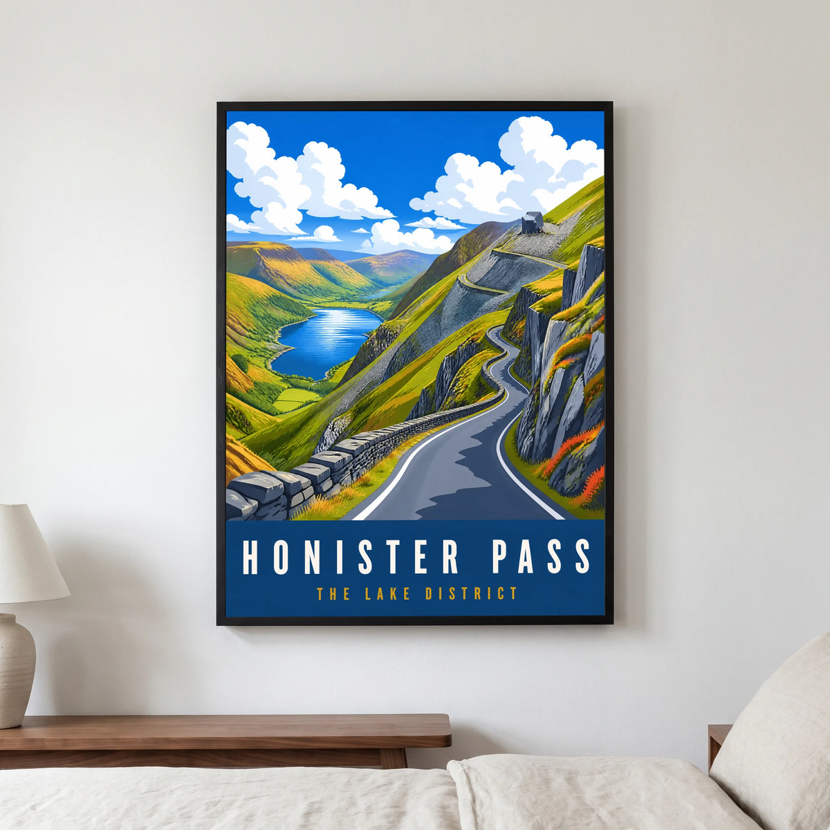Honister Pass travel poster in a black frame, hanging in a bedroom3