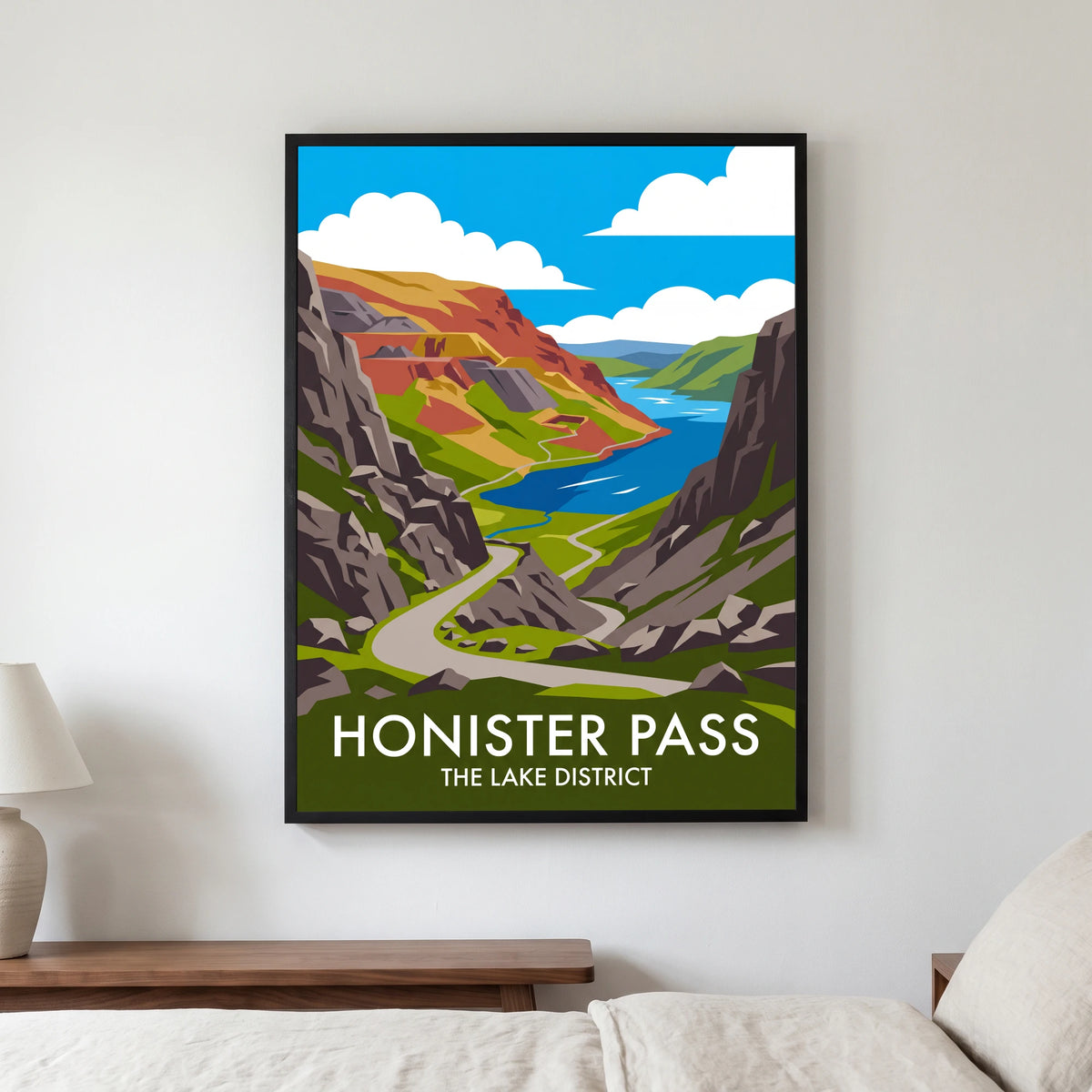 Honister Pass travel poster in a black frame, hanging in a bedroom3