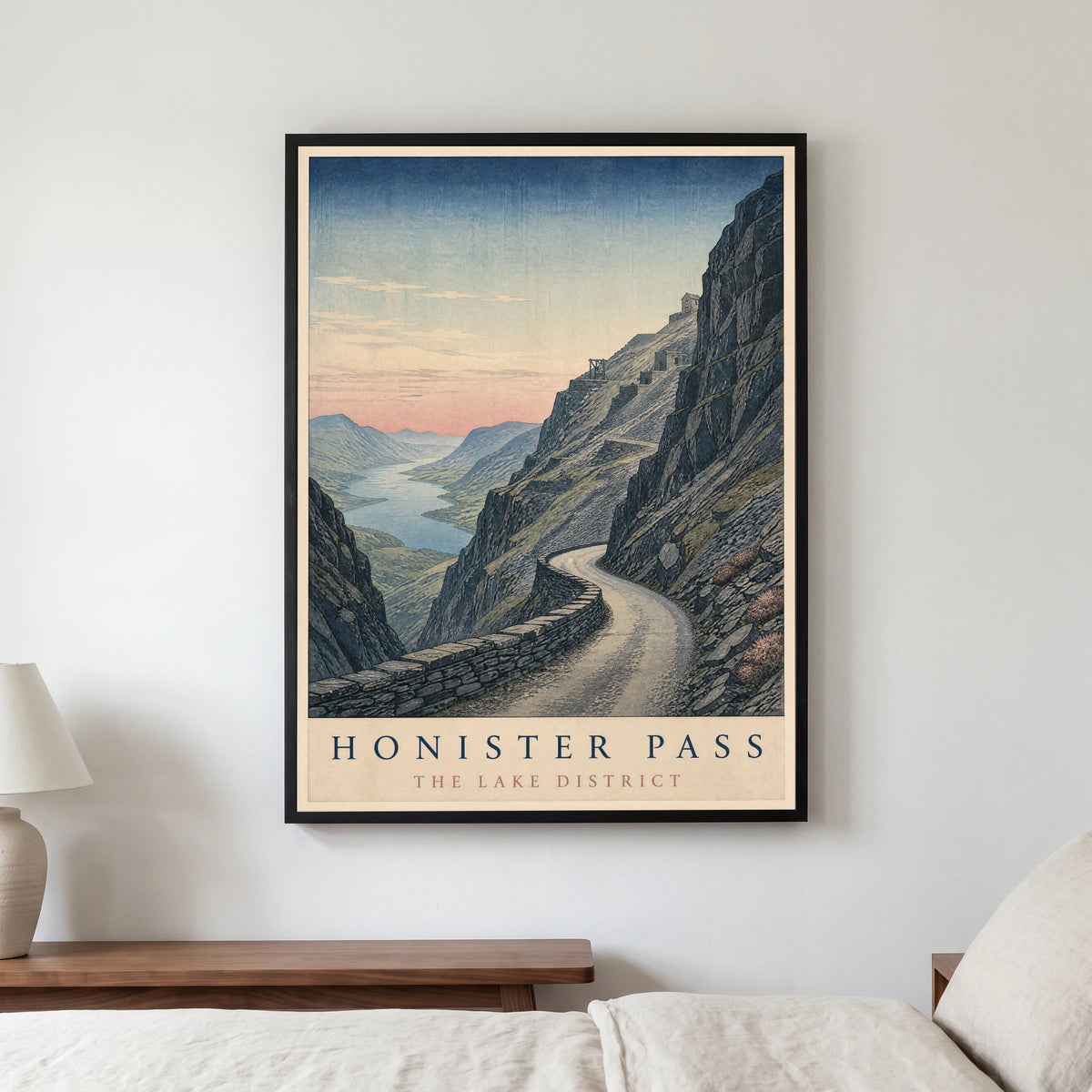 Honister Pass travel poster in a black frame, hanging in a bedroom3