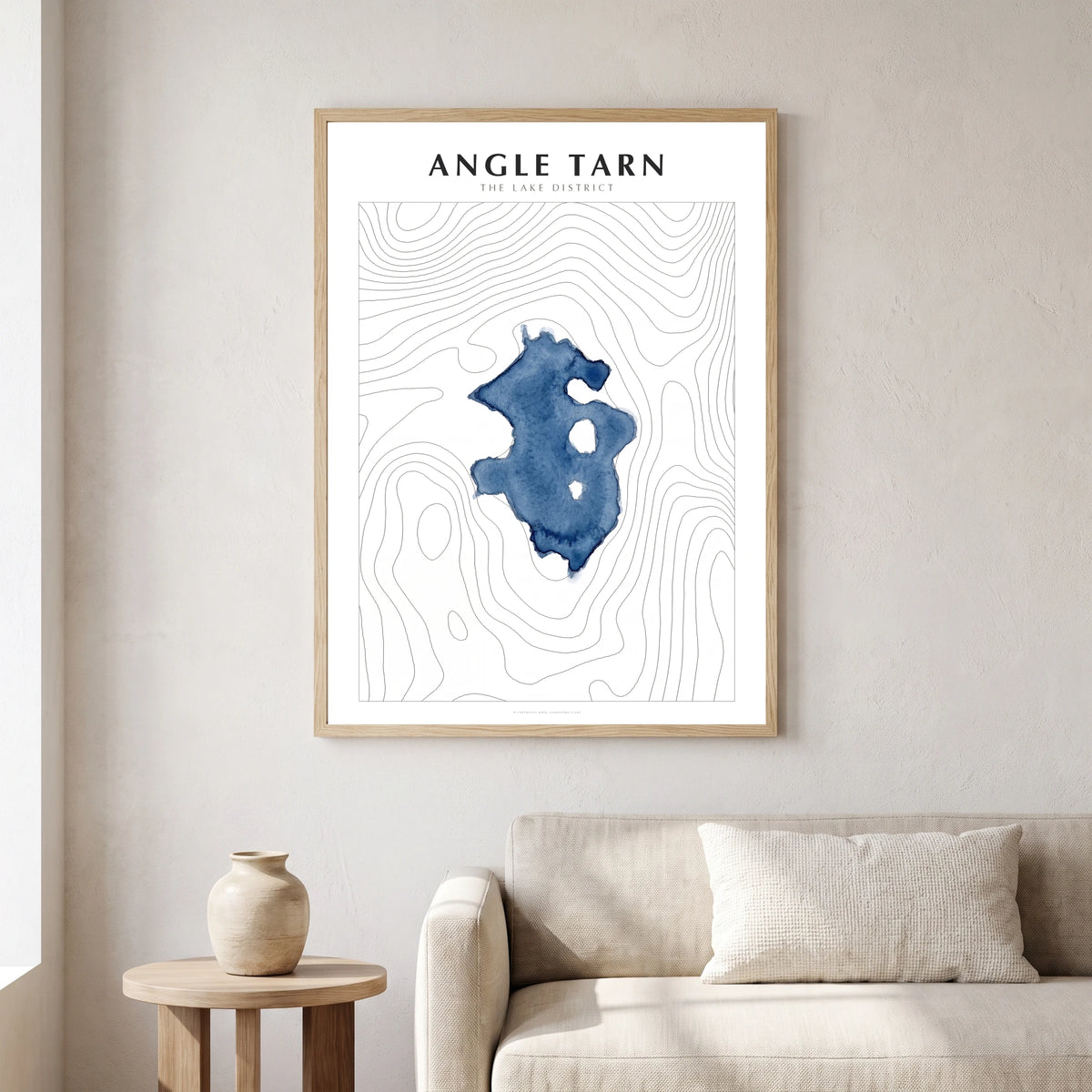 Angle Tarn lake map poster in a natural frame, hanging in a living
