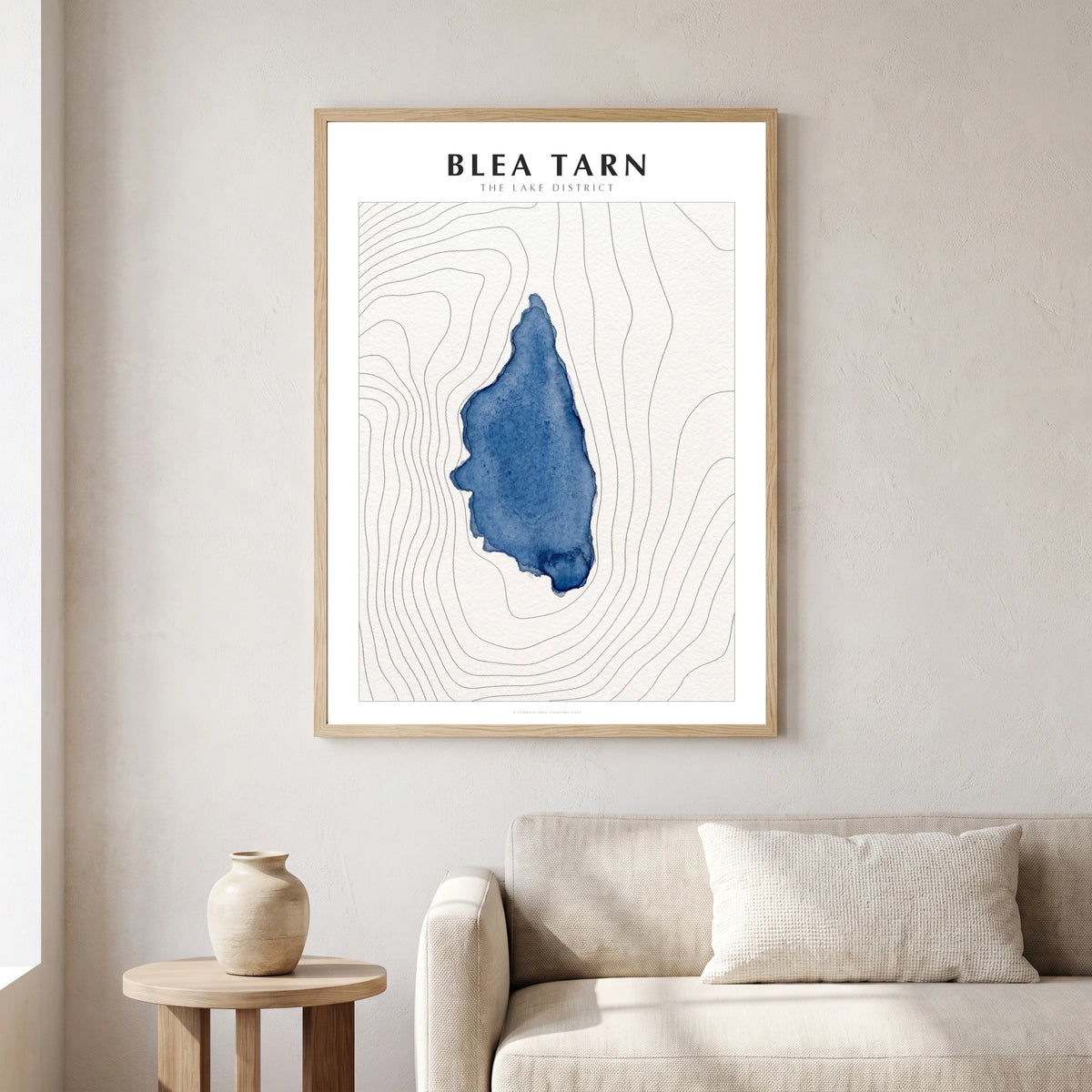 Blea Tarn lake map poster in a natural frame, hanging in a living