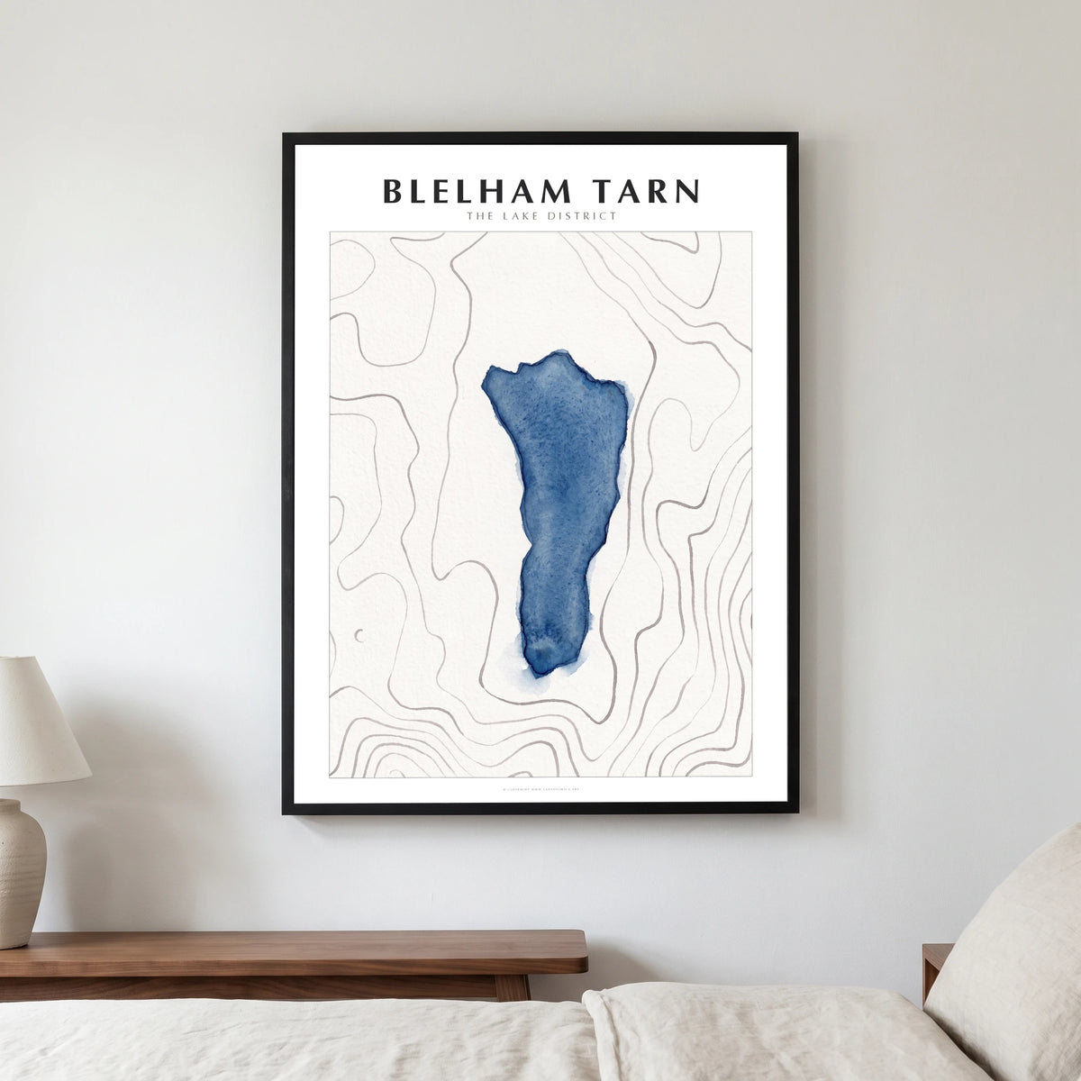 Blelham Tarn lake map poster in a black frame, hanging in a bedroom