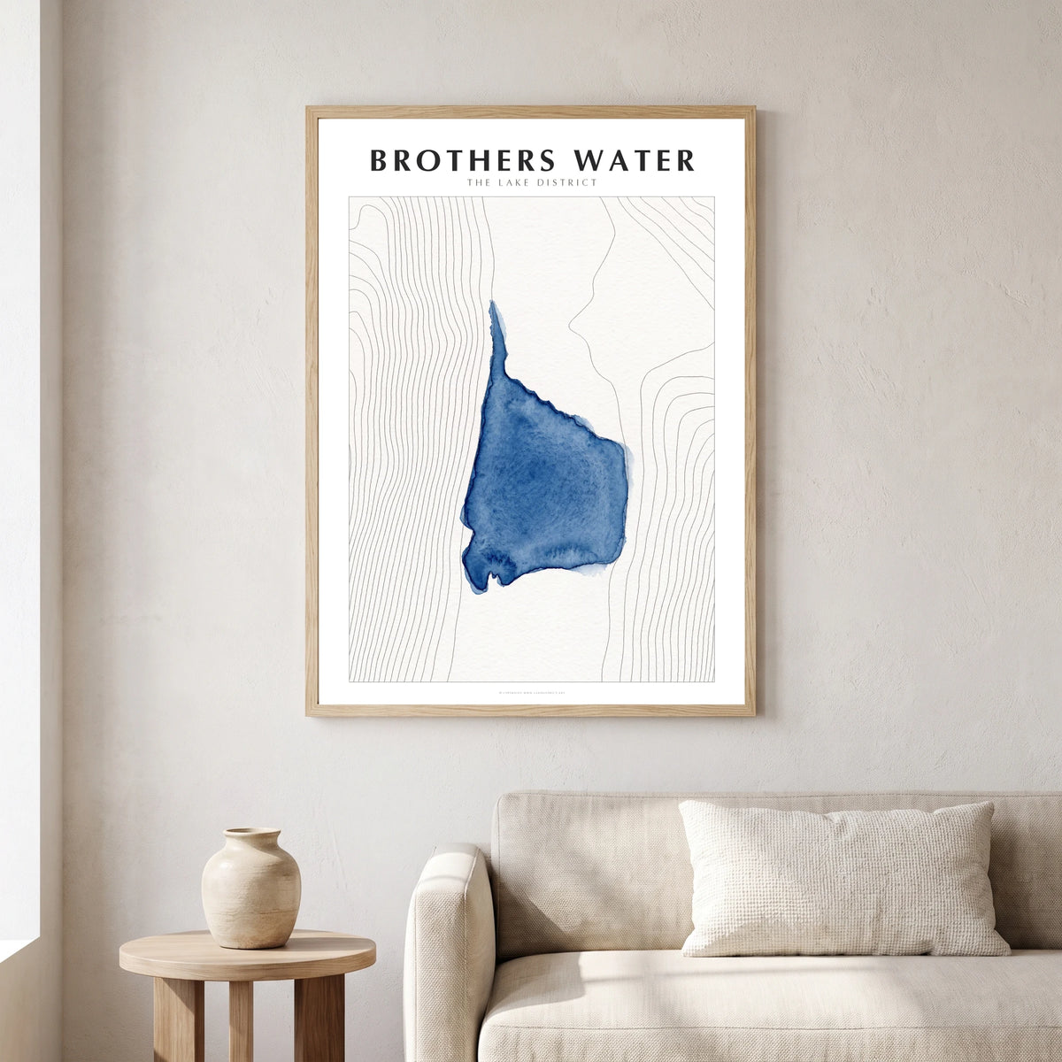 Brothers Water lake map poster in a natural frame, hanging in a living